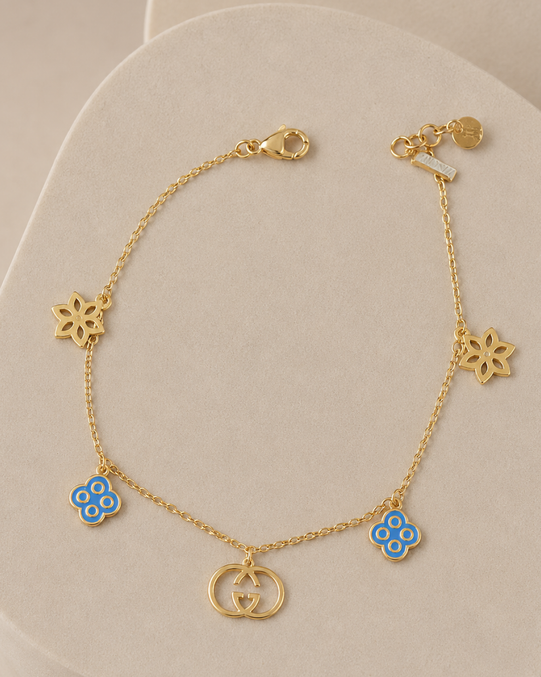 BLUE ENAMEL & FLORAL MULTI-CHARM BRACELET