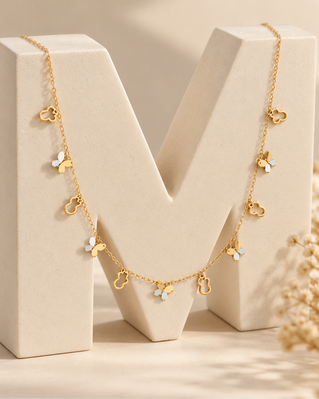 GOLD MULTI-CHARM BUTTERFLY & CLOVER STATION CHAIN NECKLACE